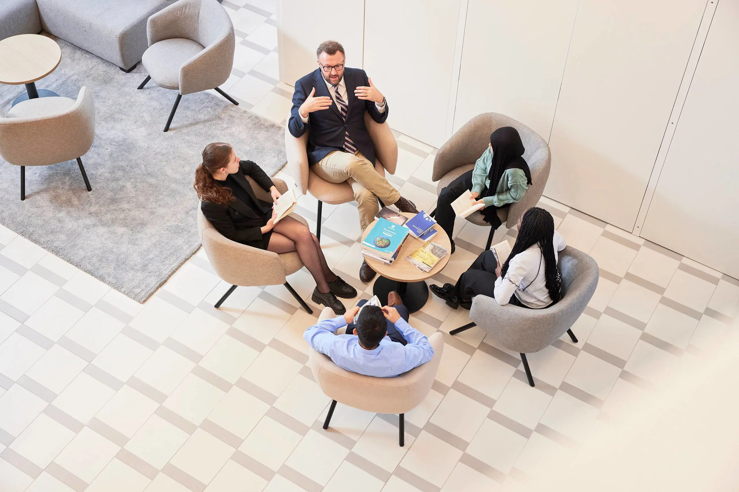 Teacher and students conversing
