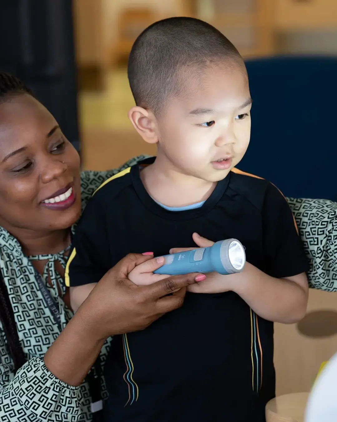 Teacher assisting student in class