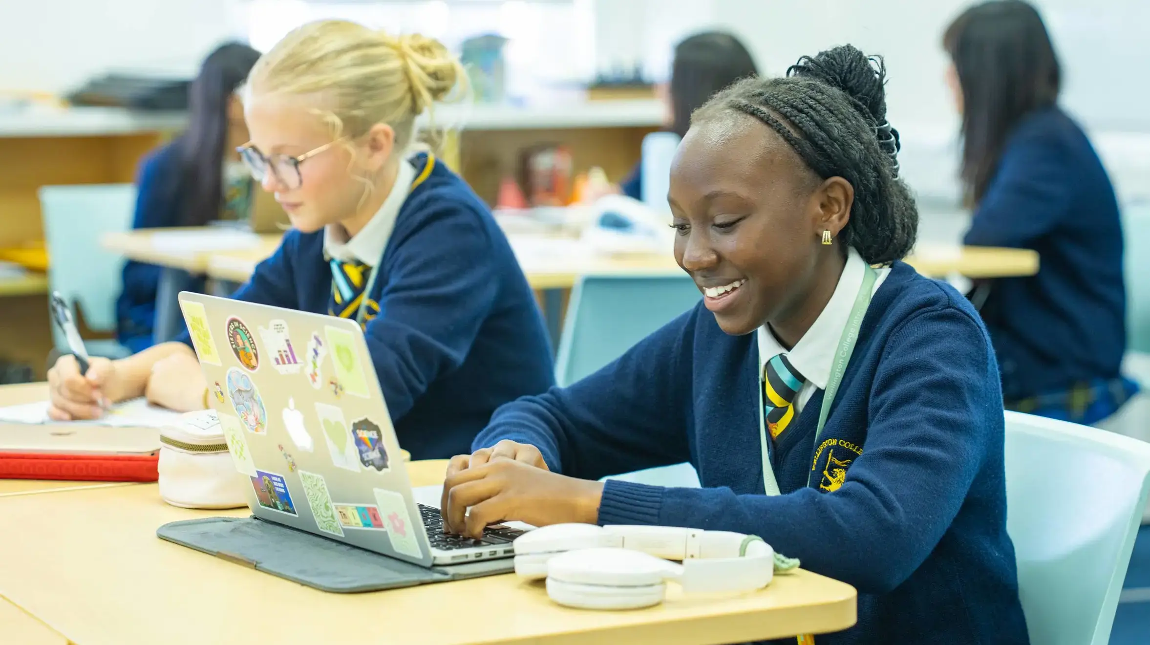 Students doing classwork on laptops