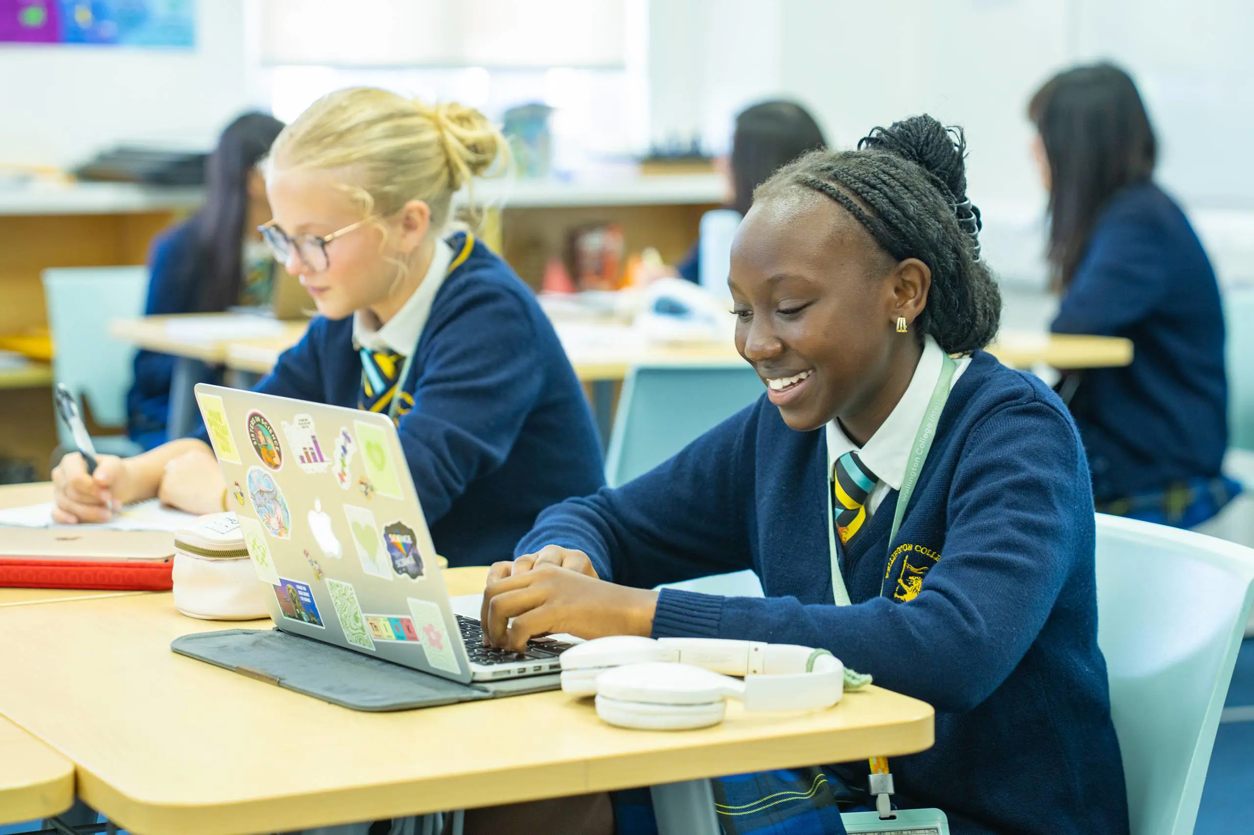 Students doing classwork on laptops