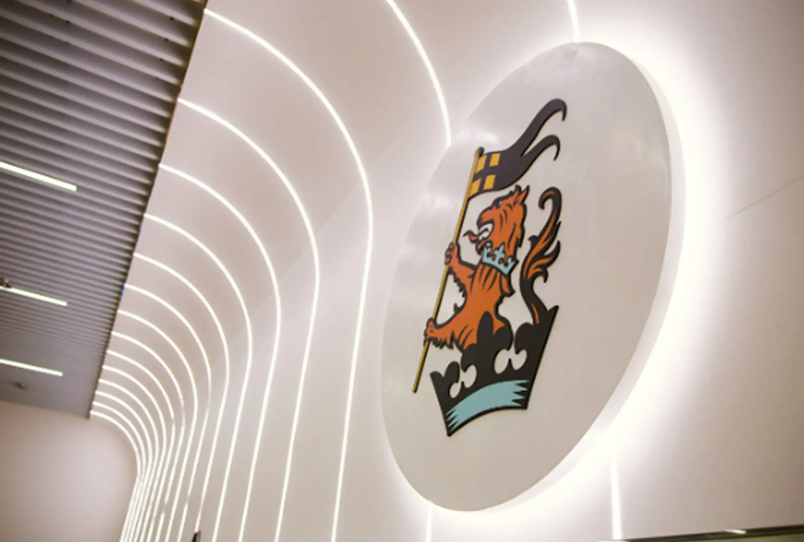 Wellington college lagos logo on wall