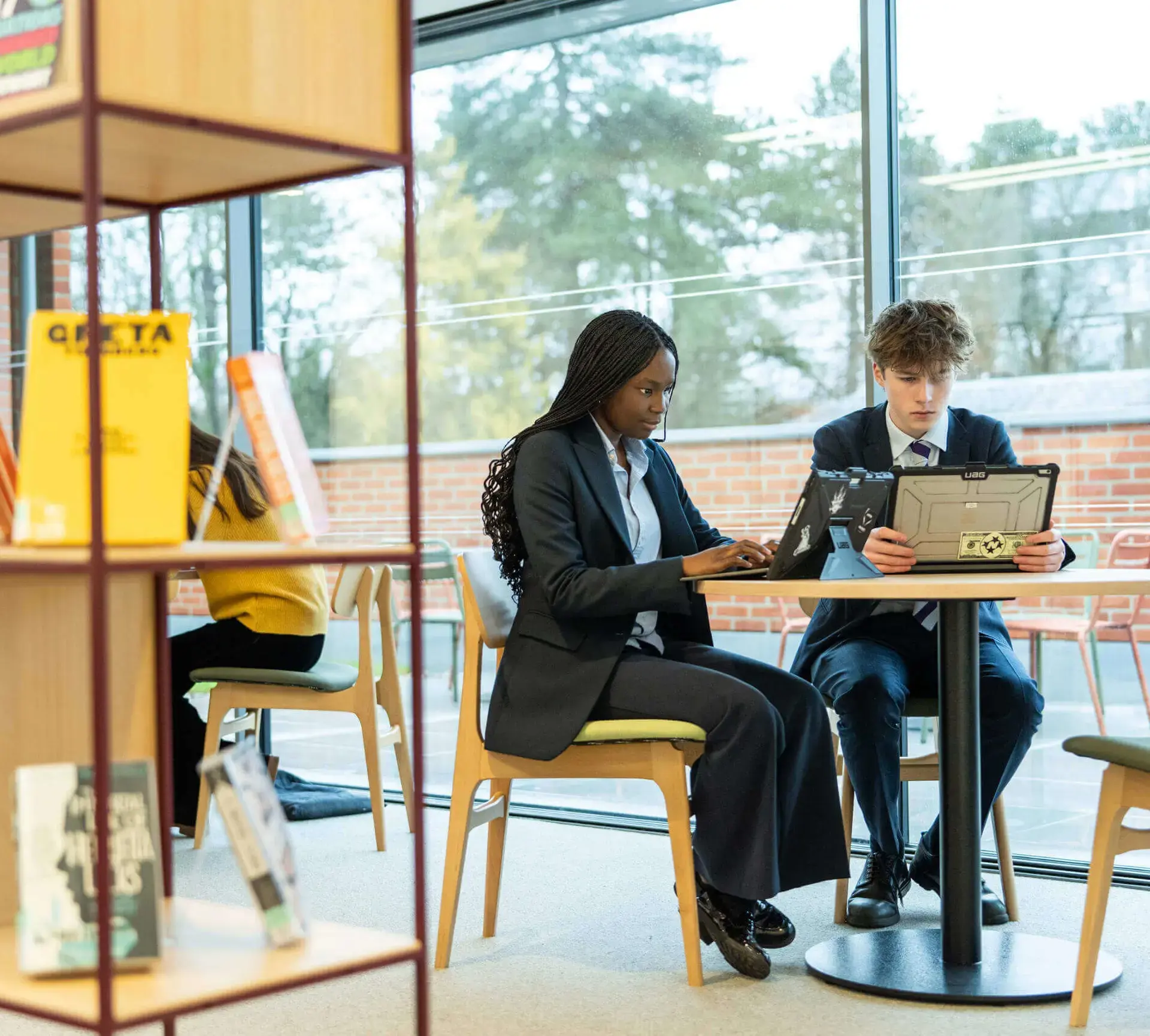 Students sitting at table in light, airy room
