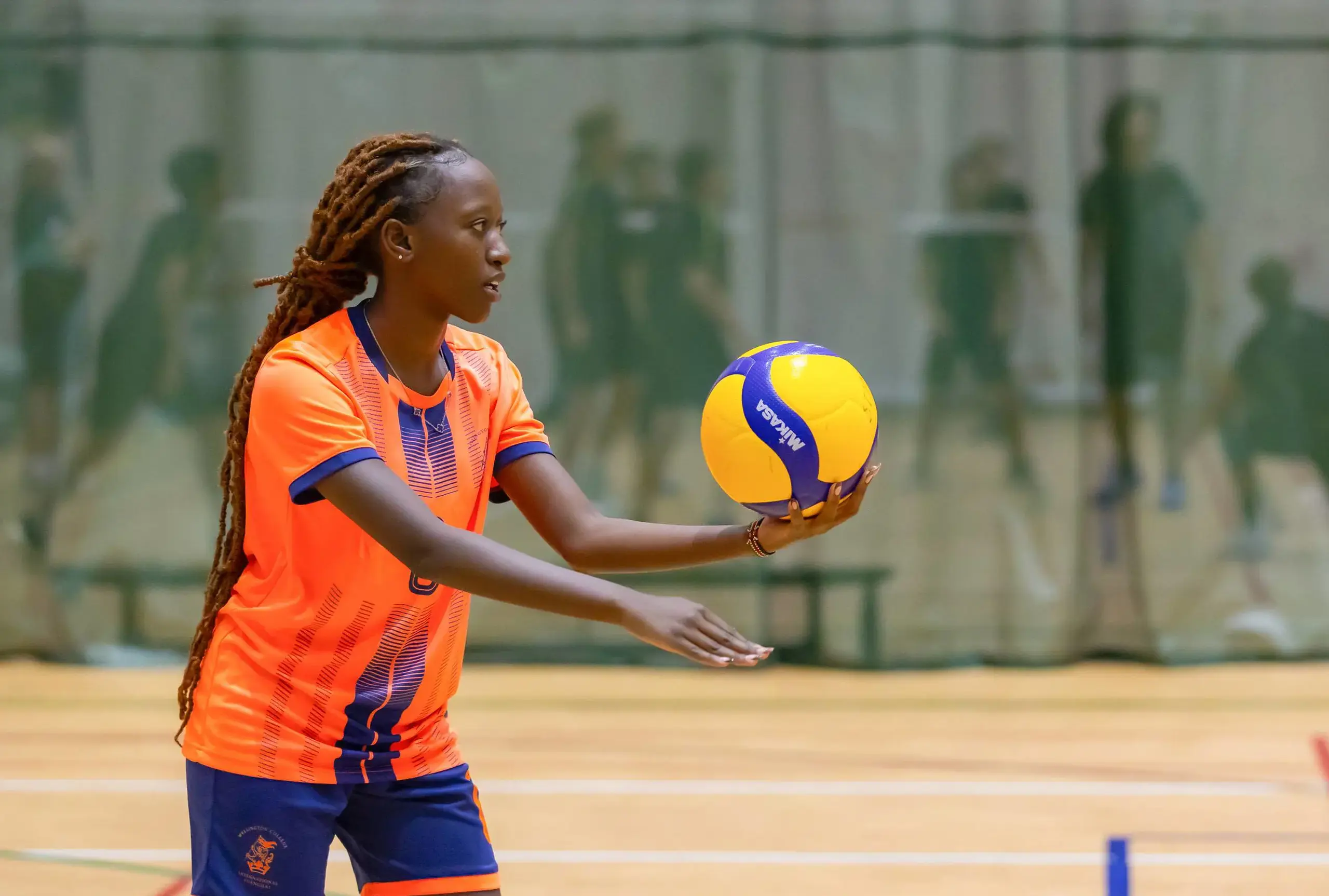 Student playing volleyball